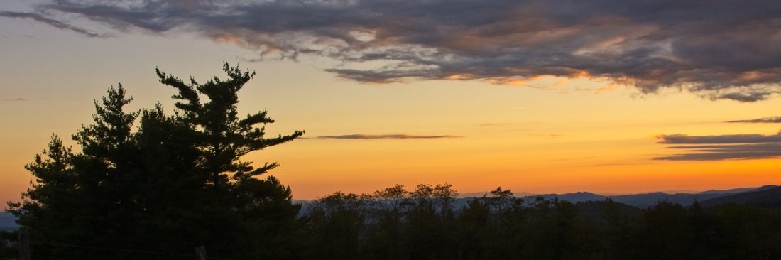 Panoramic sunset stretching across rolling Blue Ridge horizons